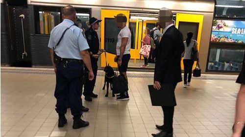 Police patrol a platform at Bondi Junction with a drug dog