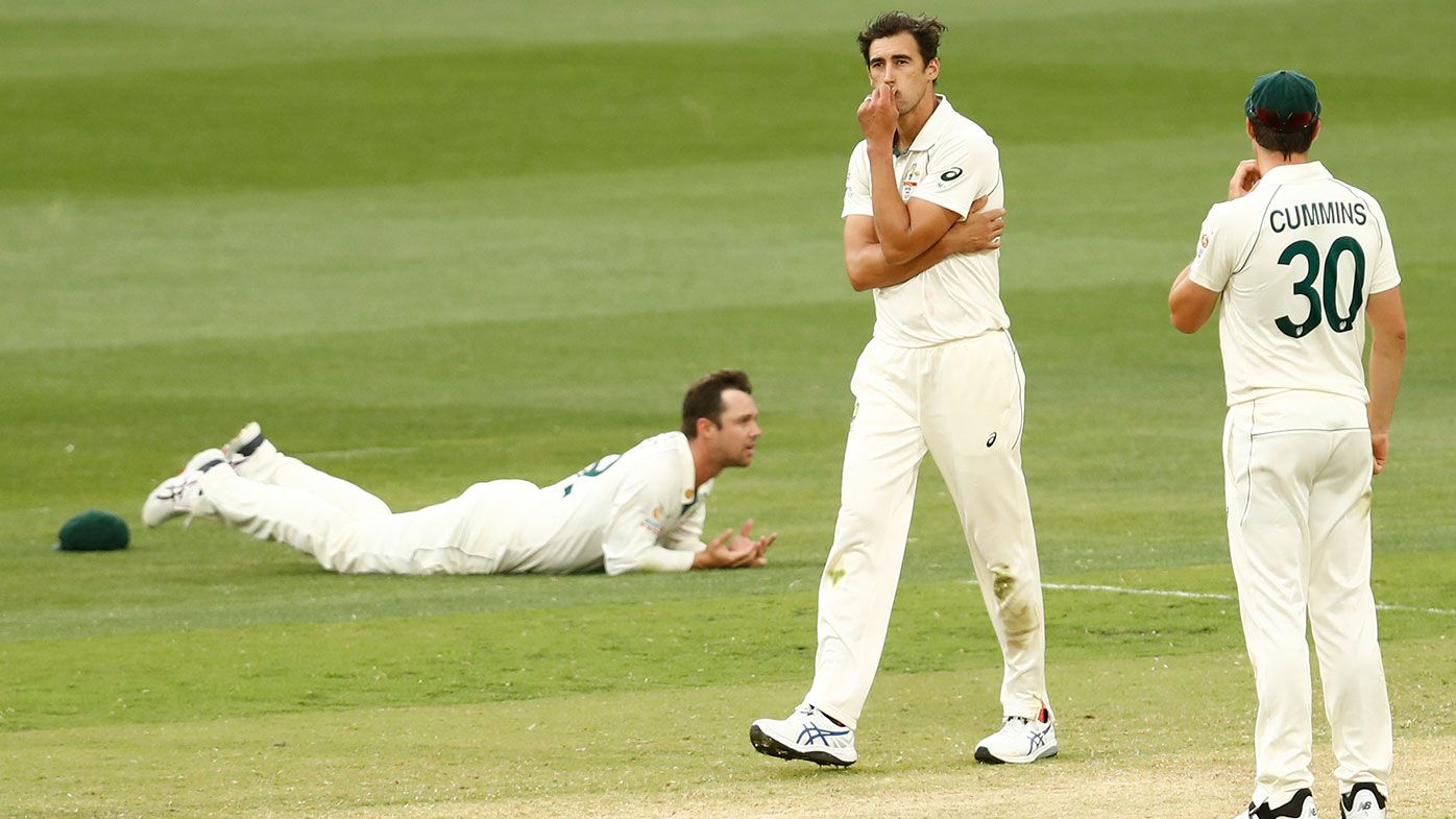 Mitchell Starc reacts after Travis Head drops a catch off his bowling.