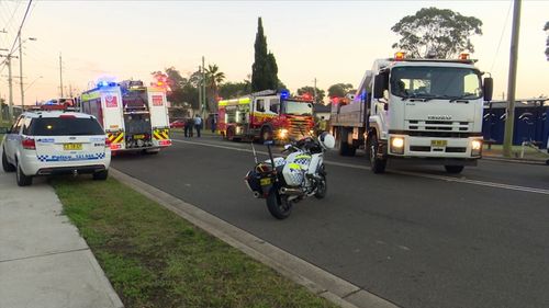 The man was treated at the scene as thick smoke billowed from the top of the home. Picture: 9NEWS.