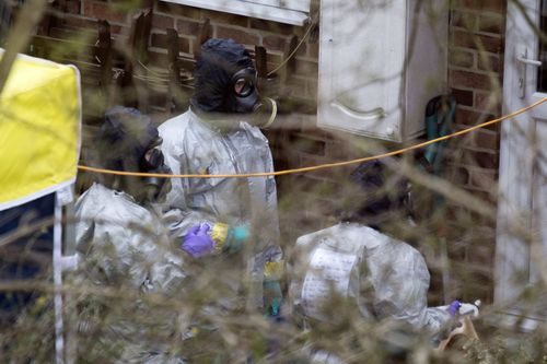 A team from the Organisation for the Prohibition of Chemical Weapons inspect the back garden of house on the road where former Russian spy Sergei Skripal lived in Salisbury. (AAP)
