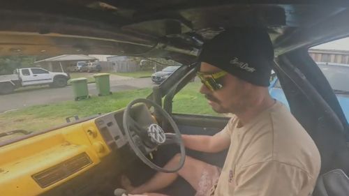 A Queensland man has been charged after allegedly modifying a car and performing "childish" stunts, including a car versus men tug of war.Sam Eyles, 29, from the Sunshine Coast is accused of further modifying an already heavily modified "clown car" and using it to perform "dangerous manoeuvres".