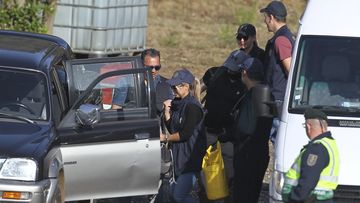 Police search teams prepare to set out from an operation tent near Barragem do Arade, Portugal, Wednesday May 24, 2023.  