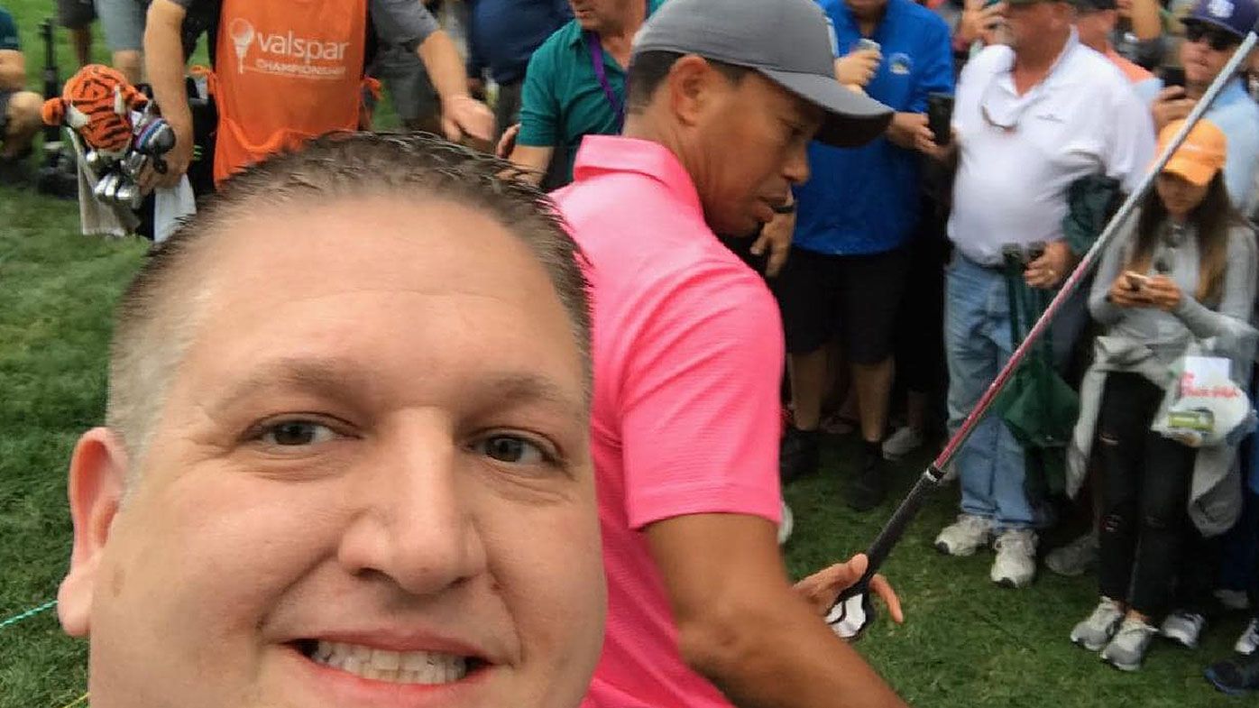 The golf fan pictured has filed a lawsuit against Tiger Woods