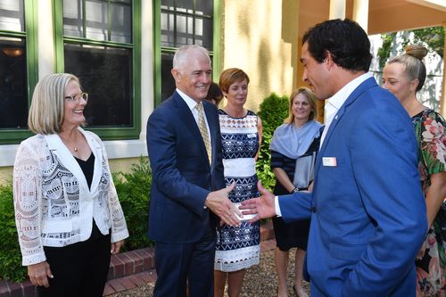 Prime Minister Malcolm Turnbull greets Queensland Australian of the Year finalist Johnathan Thurston at a 2018 Australian of the Year finalist morning tea. (AAP)