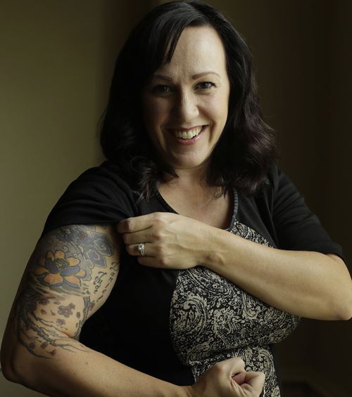 Army helicopter pilot MJ Hegar got a tattoo to cover her shrapnel wounds. Now she's running for Congress in Texas.