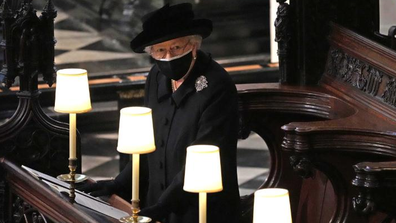 Queen Elizabeth II watches as pallbearers carry the coffin of Prince Philip, Duke Of Edinburgh into St. George's Chapel at Windsor Castle on April 17, 2021.