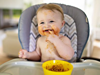 A Little b eating her dinner and making a mess