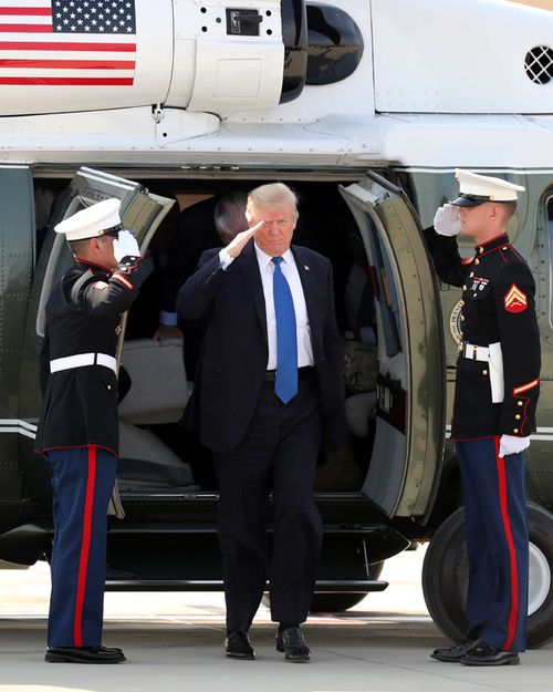 US President Donald Trump alights from a helicopter after arriving at Camp Humphreys in Pyeongtaek, south of Seoul.