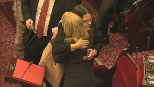 Fellow MPs hugged Ms Carling-Jenkins after she made her powerful speech. (9NEWS)
