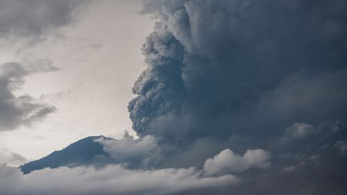 Thick clouds of smokes are seen from Mount Agung volcano during an eruption in the district of Karangasem, Bali. (AAP)