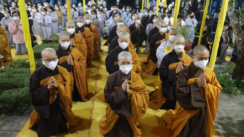Monks and Thich Nhat Hanh followers pray during the funeral of the renowned monk in Hue, Vietnam on Saturday, Jan. 29, 2022. The Zen Master, who helped spread the practice of mindfulness in the West and socially engaged Buddhism in the East died on Jan. 22, 2022 at the age of 95. (AP Photo/Thanh Vo)