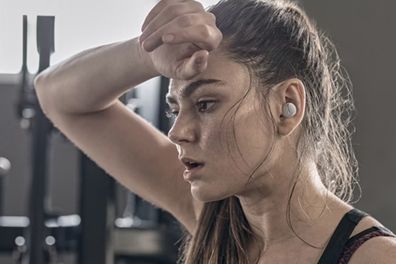 9PR: A woman exercising while wearing the Panasonic RZ-S300 True Wireless Bluetooth Earbuds