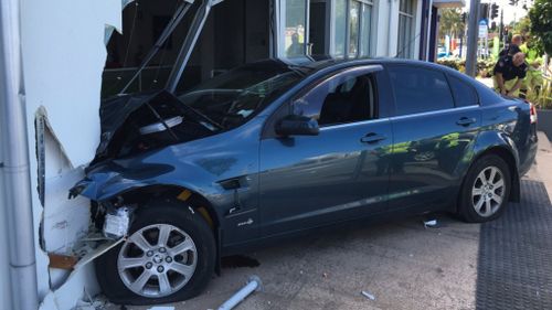 Man seriously injured after crashing car into shop on the Gold Coast