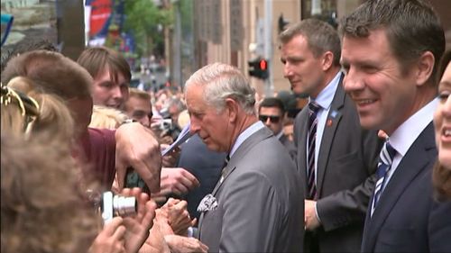 Prince Charles, accompanied by NSW Premier Mike Baird, makes his way through Martin Place. (9NEWS)