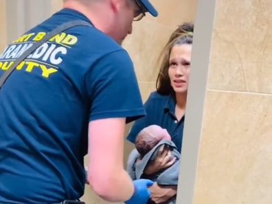 Woman gives birth in gas station toilet cubicle. 