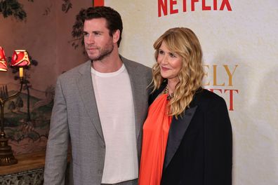 Liam Hemsworth (left) and Laura Dern pictured at a screening of "Lonely Planet" in New York City on October 1.