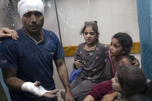 Palestinians wounded in the Israeli bombardment of the Gaza Strip for treatment in a hospital in Khan Younis, Tuesday, Oct. 17, 2023.