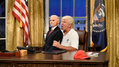 Kate McKinnon as Attorney General Jeff Sessions sits on the lap of Alec Baldwin's President Donald Trump. (AP)