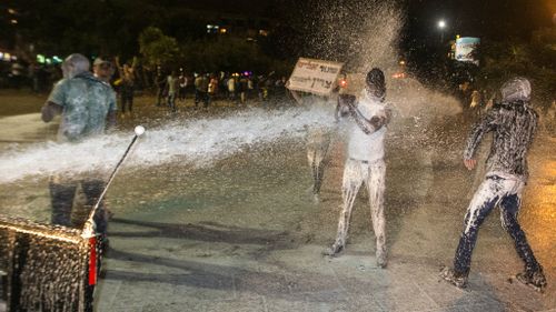 Police used water cannons and pepper spray to disperse the angry crowd. (AFP).