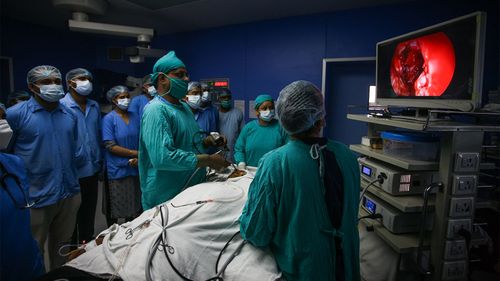 A surgeon removes infected tissue from a patient suffering from black fungus in Allahabad, India.