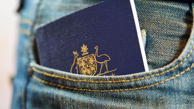 Australian passport in jeans pocket, close up.