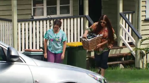 The woman returned to her home today to collect some belongings. (Image: 9NEWS)