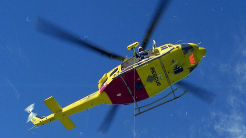 Rescue Helicopter exercises near Summerhill waste management site Wallsend, paramedics David Hopkins and David Higgins winched up as Garry Vincent, Westpac crewman on ground assists . Stewart Nickisson mans the winch photo by Peter Stoop 7-8-1996 Rescue Helicopter exercises near Summerhill waste management site Wallsend, paramedics David Hopkins and David Higgins winched up as Garry Vincent, Westpac crewman on ground assists . Stewart Nickisson mans the winch.