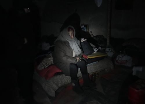 An elderly resident hides in a basement for shelter with no electricity, water or food in the centre of the town of Irpin, some 25 km  northwest of Kyiv, Friday, March 11, 2022.
