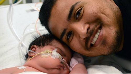 Baby Mia Hernandez with her proud father, Francisco. (Supplied)