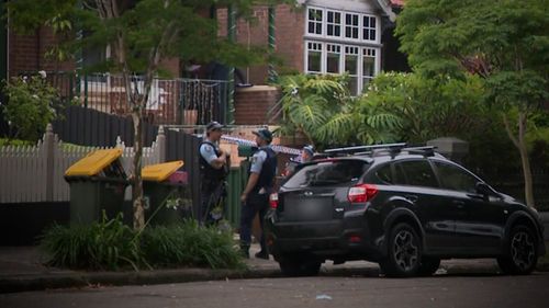 A father believed to be armed with a gun locked himself inside a home with his 18-year-old autistic son in Sydney's Inner West.