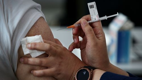 A nurse administers the Pfizer vaccine to a client at a pop-up clinic at the Lebanese Muslim Association (LMA) in Lakemba last month.