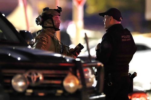 Heavily armed Police at the scene of a mass shooting at Bondi Beach on December 14, 2025 in Sydney, Australia.