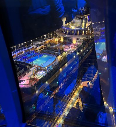 A bird's-eye view of the ship lit up at night from the North Star.