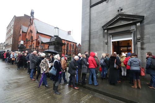 People queued for hours outside St Joseph's Church in Limerick to say their farewells to the 46-year-old singer (AAP).