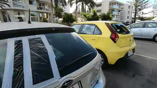 Man charged over 'glass smashing rampage' which saw close to 40 cars damaged at Burleigh Heads