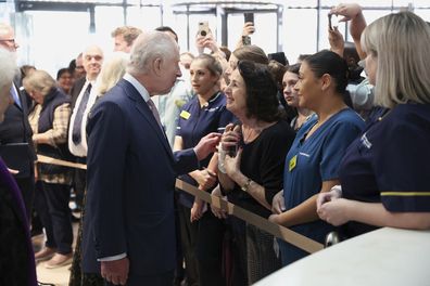 King Charles III meet with staff members during a visit to the University College Hospital Macmillan Cancer Centre in London, Britain, Tuesday,April 30, 2024.  