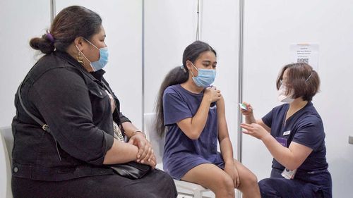 A 12-year-old is vaccinated at a clinic in Dandenong in Victoria.