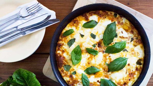 Bacon, pumpkin and feta frittata with warm tomato relish and cucumber salad. Image: My Food Bag