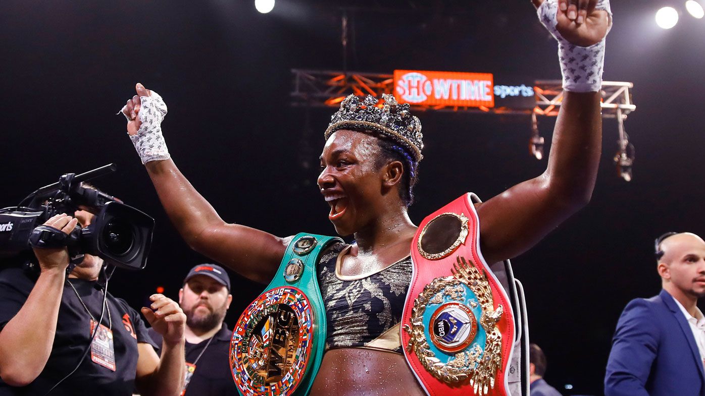 Claressa Shields poses for photographs after defeating Ivana Habazin 