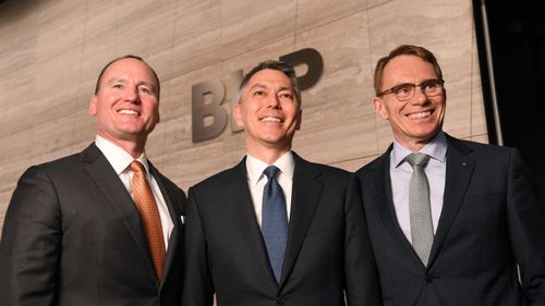 BHP Chairman Ken MacKenzie (left), BHP CEO-Elect Mike Henry (centre), BHP chief executive Andrew Mackenzie (right).