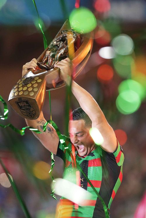 John Sutton of the Rabbitohs holds aloft the premiership trophy. (Getty)