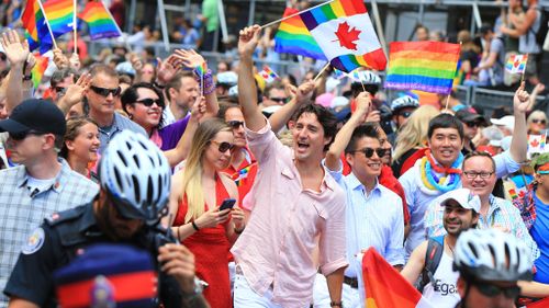 Prime Minister Justin Trudeau marches in the parade. (AFP)
