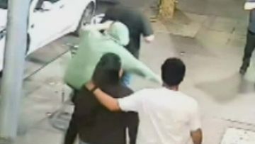 One of the stabbings occurred outside a CBD burger restaurant. Raftopoulos, pictured in the green jumper, is facing 15 charges.