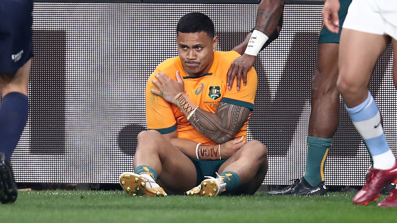 Len Ikitau of the Wallabies holds his shoulder after scoring a try during the Rugby Championship match between the Australia and Argentina.