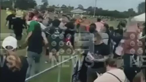 A Brisbane father has sustained serious injuries following a wild brawl at a junior rugby league game over the weekend, with new footage showing the escalation of the altercation. 