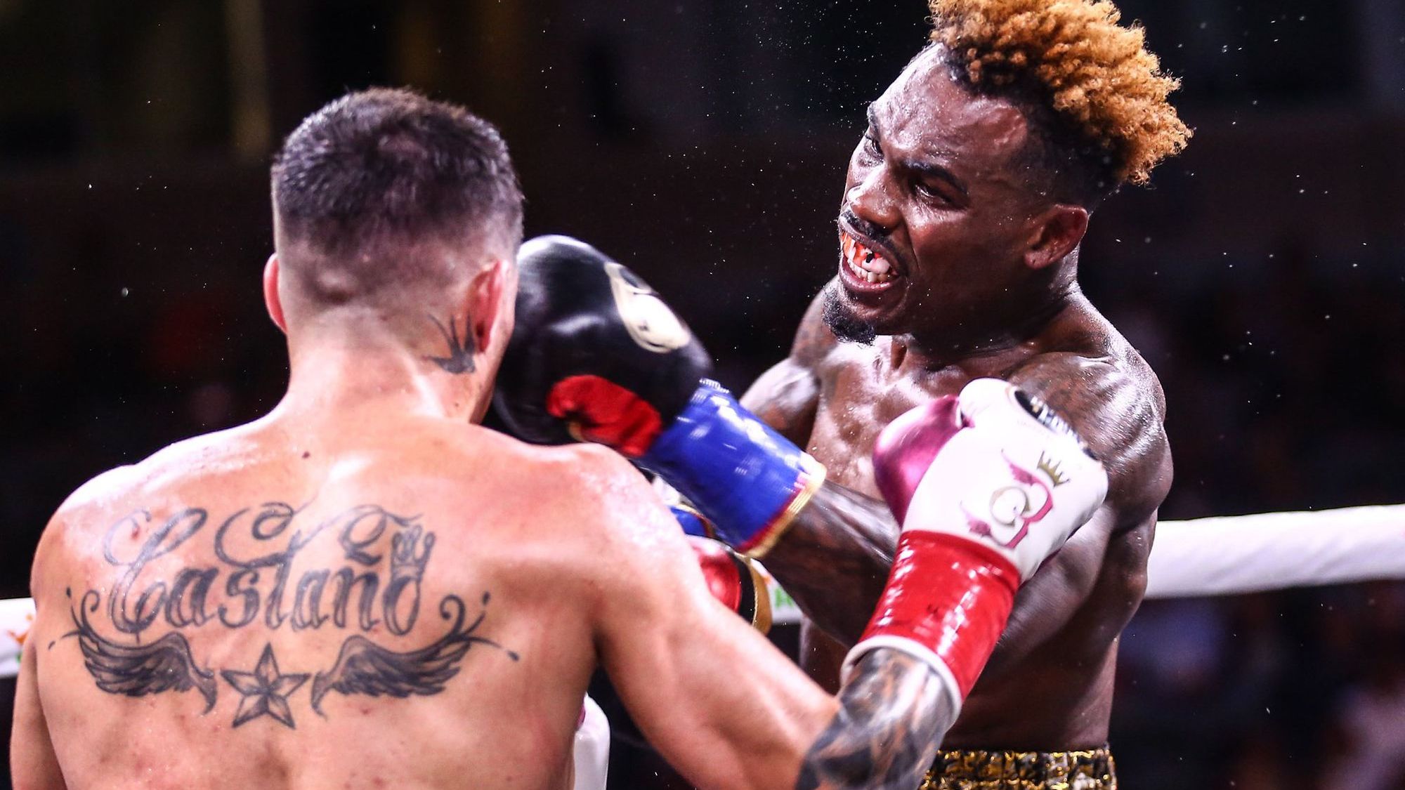 Jermell Charlo lands a punch on Brian Castano in their epic bout.