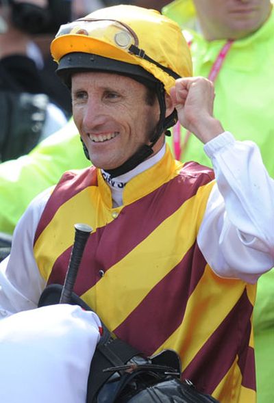 Jockey Damien Oliver celebrates his win in the Victoria Derby. (AAP)