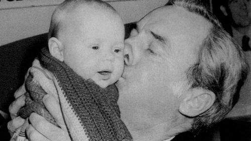 Then-opposition leader Bill Hayden kisses a baby while campaigning in Queanbeyan in Eden-Monaro in 1982.