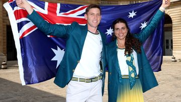 Eddie Ockenden and Jessica Fox of Team Australia pose with an Australian flag after being named flagbearers ahead of Paris 2024.