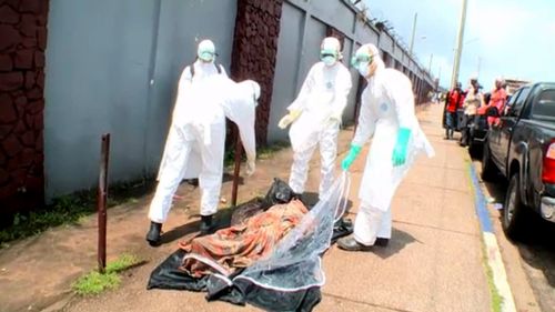 An American news crew has captured the moment a seemingly dead man in Ebola-hit Monrovia awakens.